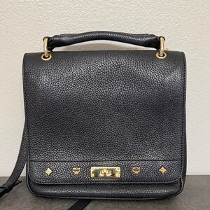 Preloved black MCM crossbody with gold tone hardware